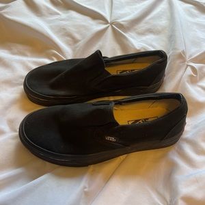 All black slip on Vans
